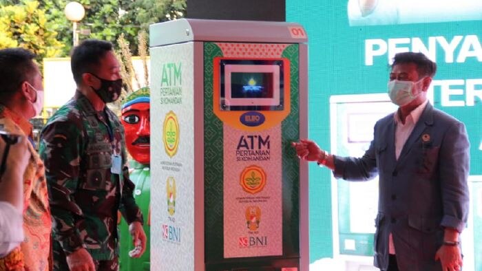 Officials unveil one of the Government's 'rice ATMs' in Jakarta, Indonesia.