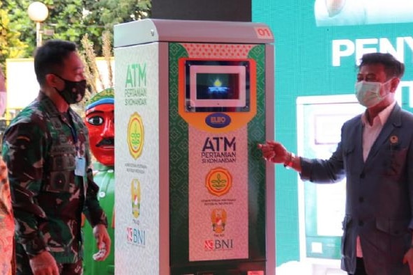 Officials unveil one of the Government's 'rice ATMs' in Jakarta, Indonesia.