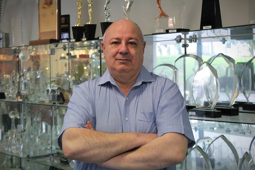 Robert Pintabona at his trophy shop