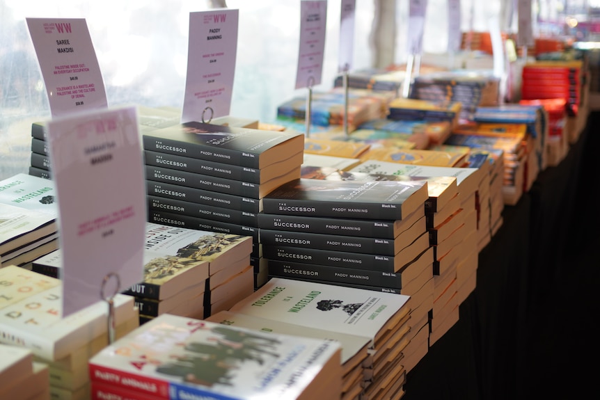 Piles of books in the Adelaide Writers' Week book tent.