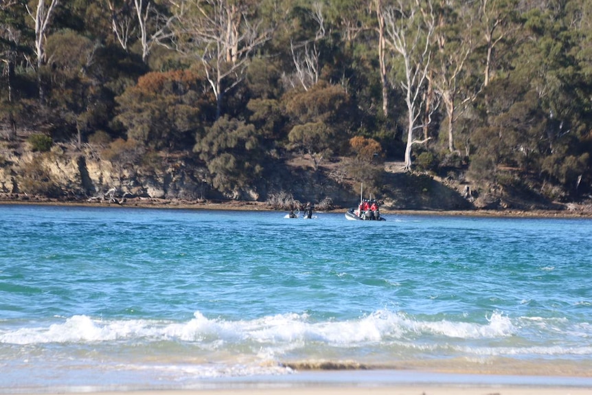 Police recovering submerged boat at Marion Bay