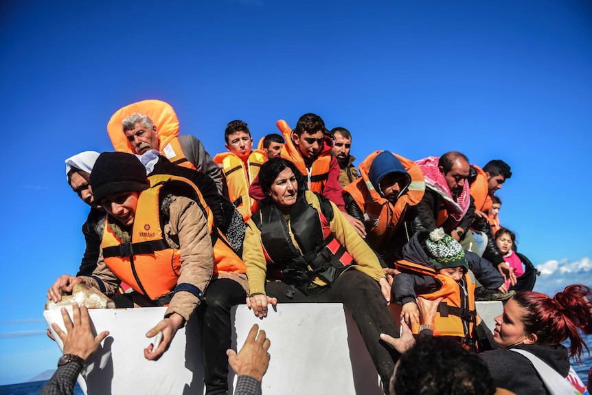 People trying to get out of a boat.