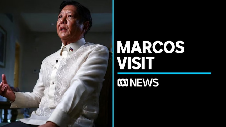 Marcos Visit: Man in white shirt sitting in chair speaking