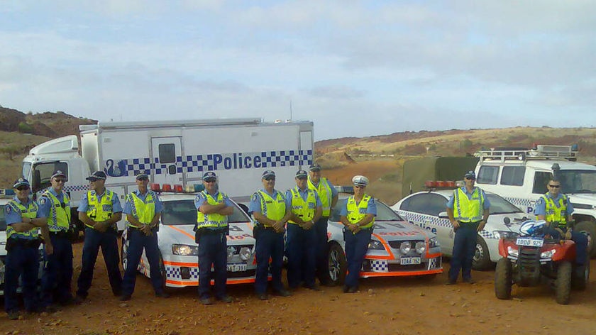 Police at Karratha man road after Woodside's Pluto strikers picket