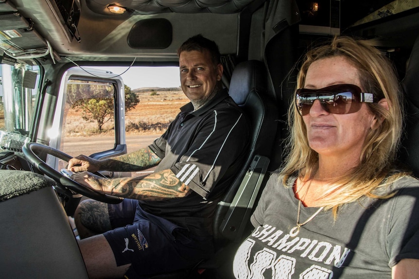 Truck driver and passenger in cab of prime mover