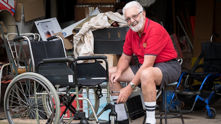 Errol Chinner repairs a wheelchair for Largs Bay Rotary.
