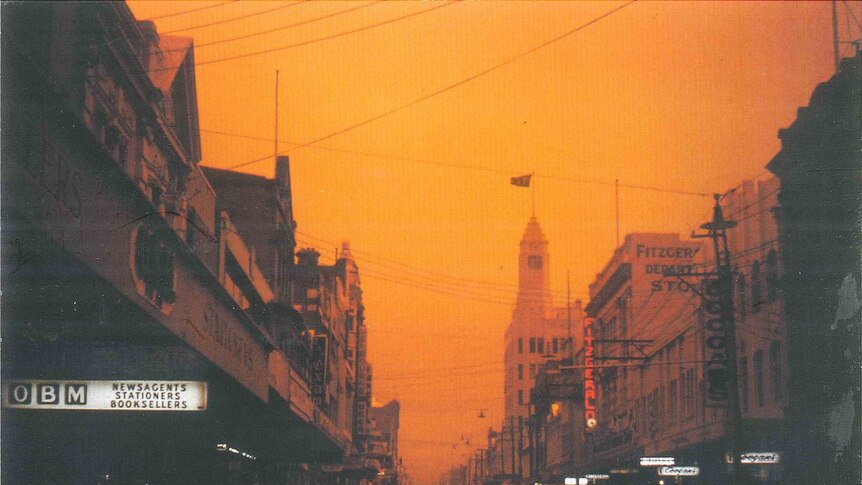 Corner of Elizabeth St and Collins St, looking west towards Mount Wellington at height of the 1967 bushfire.