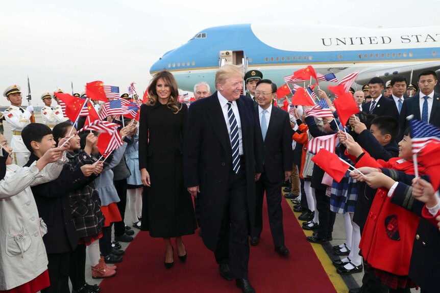 Donald Trump and Melania Trump arrive at Beijing Airport.
