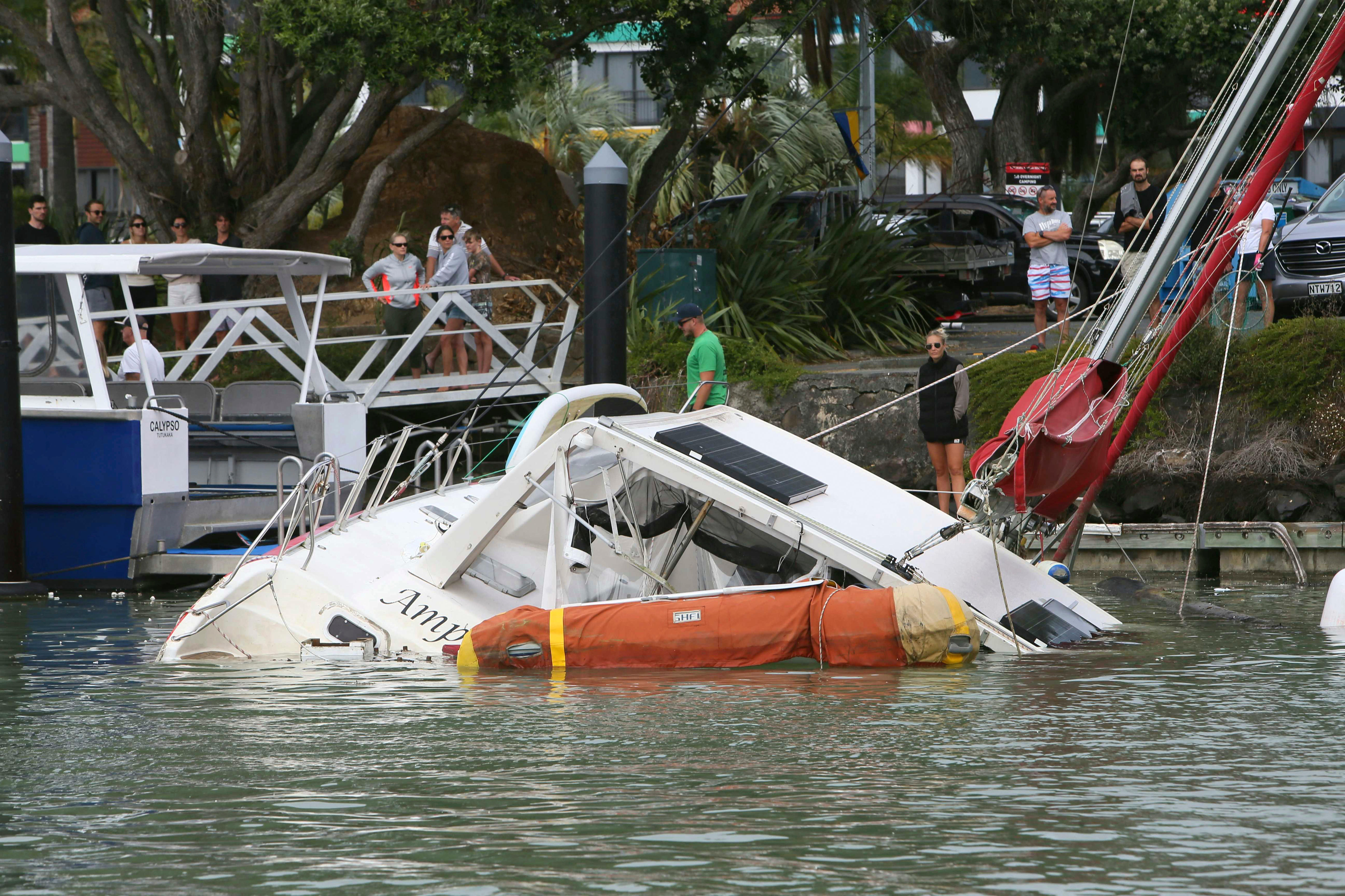 a damaged boat is partially sunk 