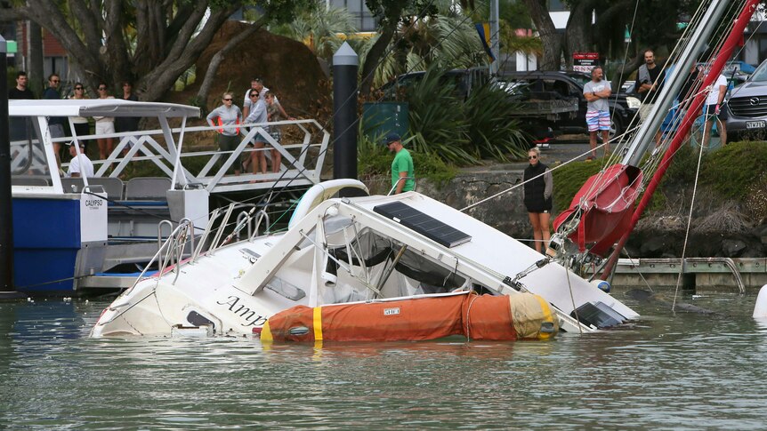 a damaged boat is partially sunk 