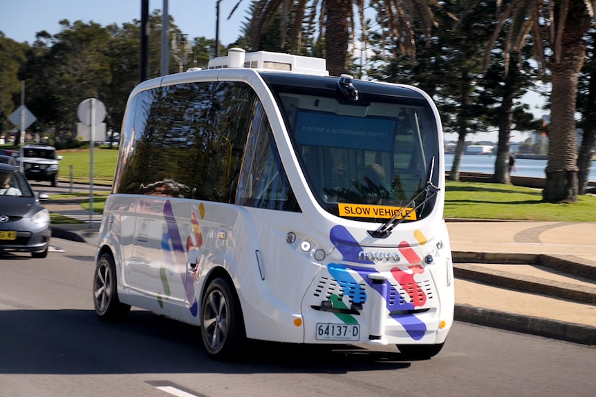 A driverless bus travels along Wharf Road in Newcastle.