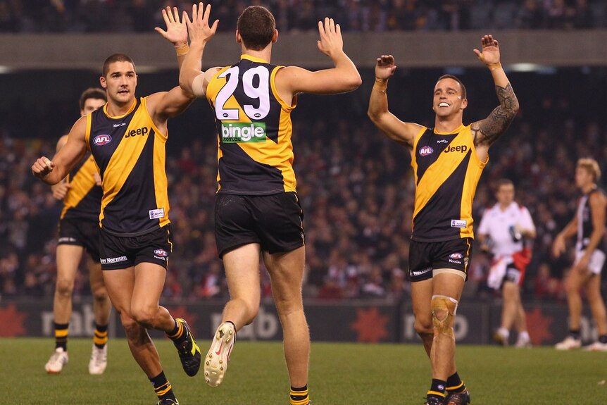 Stunning win ... Tyrone Vickery celebrates a goal with his Tigers team-mates.
