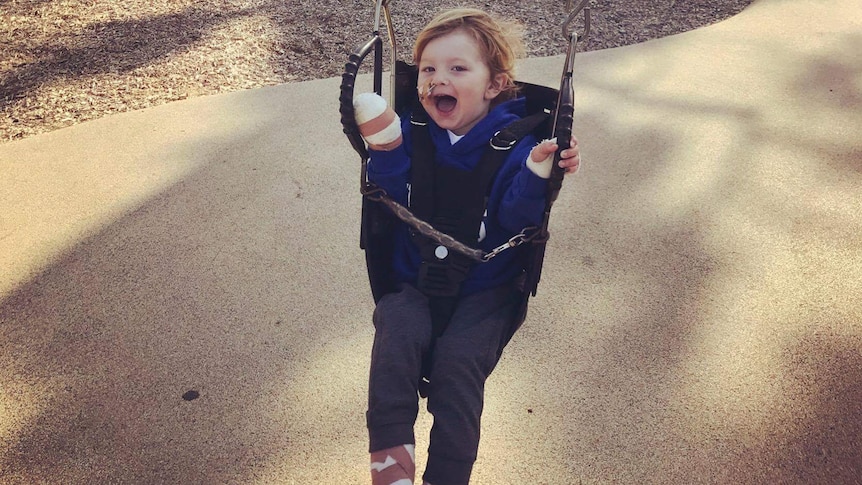 Meningococcal victim Arthur Long on swing