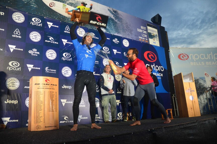 Jordy Smith celebrates with the Bells Beach trophy