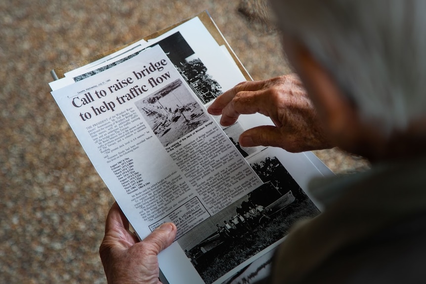 Ted Books reads an old newspaper clipping about the floods.