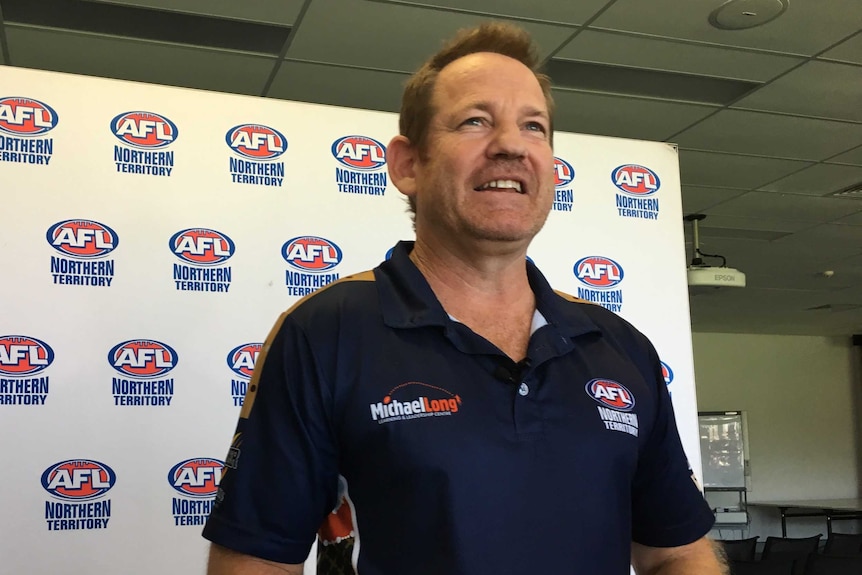 AFLNT Stuart Totham at a press conference looking past the camera lens