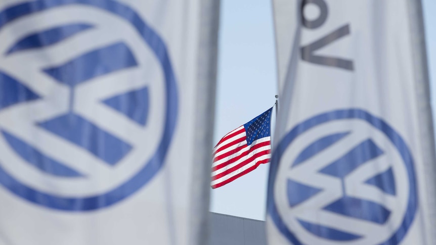 An American flag flies next to a Volkswagen car dealership in San Diego.