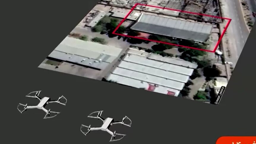 Graphic shows two animated drones moving towards satellite image of roof of factory outlined in red.