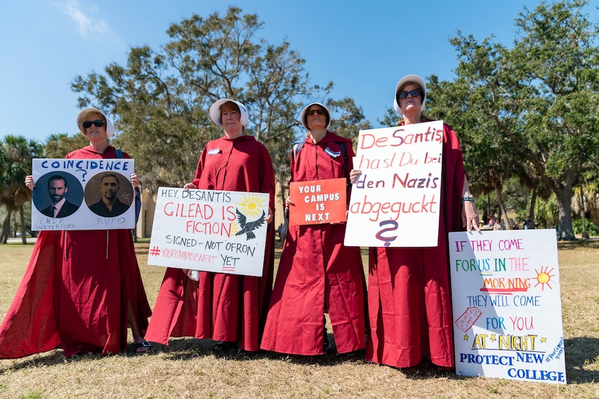 Women dressed as Handmaids Tale characters.