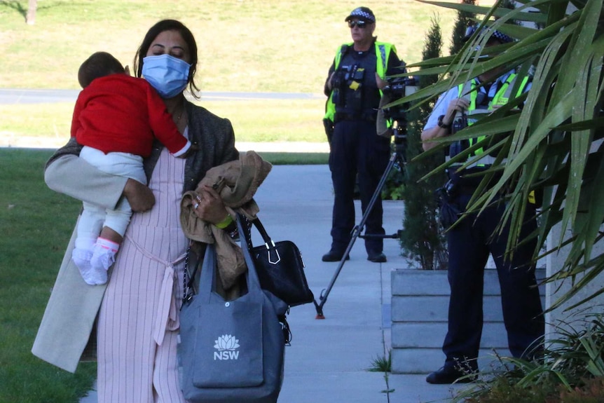 Australian mother and child return from India on May 14-15 flight arrive at Canberra accommodation for 14-day quarantine.