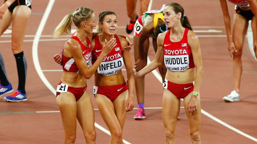 Emily Infeld of the U.S (C) is congratulated after her 10,000m bronze at the 2015 world titles.