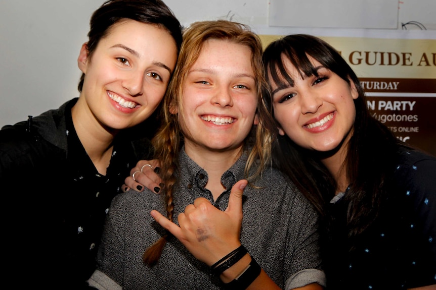 Ollie, Tessa and Jen, standing side-by-side at Closet Bar in Melbourne.