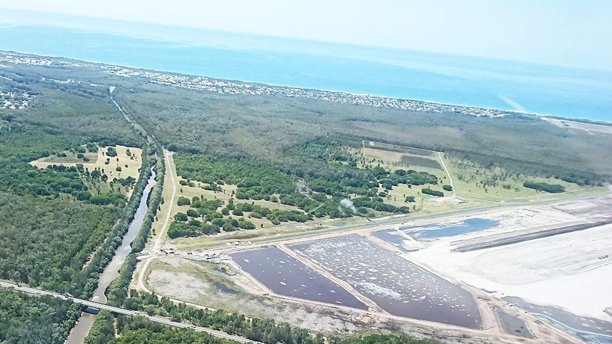 Aerial photo of PFAS water pools at airport expansion site near Marcoola Beach.