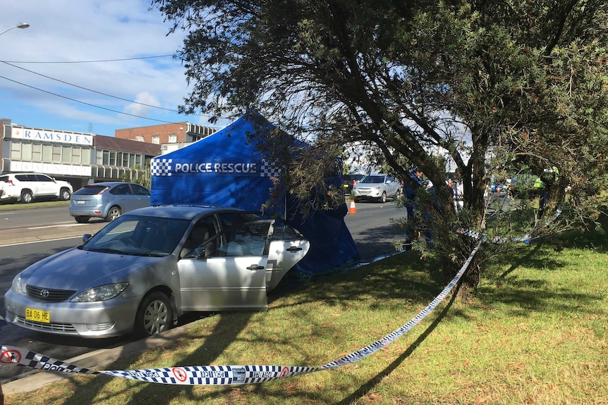 Car where body found in back at Lambton in front of police rescue tent at crime scene on street.