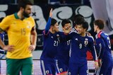 Japan celebrates Shinji Okazaki's goal against the Socceroos