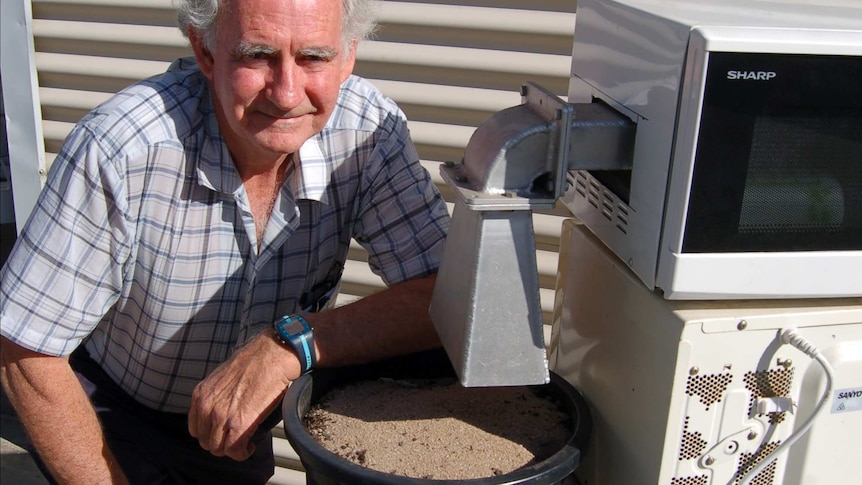Researcher John Moore with snail microwave