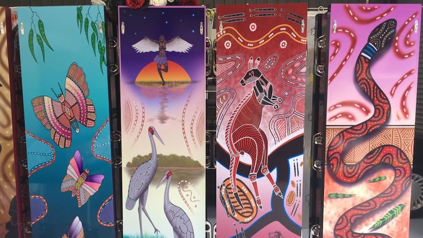 Coffins for Aboriginal funerals decorated with indigenous designs