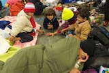 Asylum seekers sleep on the station floor in Vienna