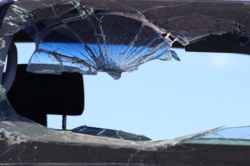 A smashed front window of a vehicle
