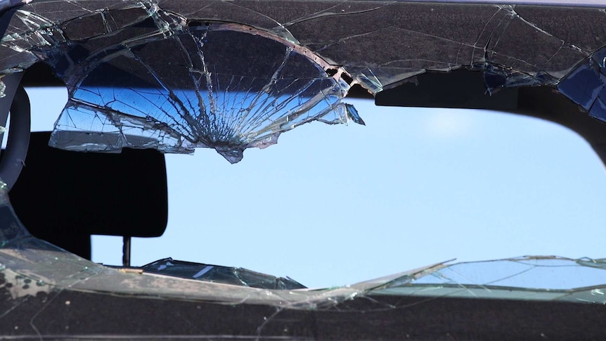 A smashed front window of a vehicle