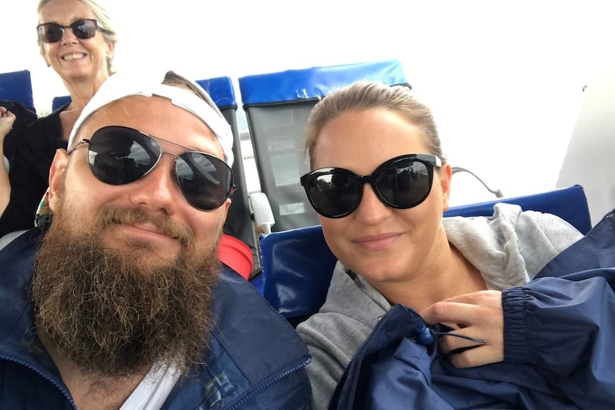 Billy Ludvigsson and Emma Andersson smile, wearing sunglasses, in a selfie.