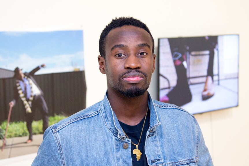 A man stands in an art gallery