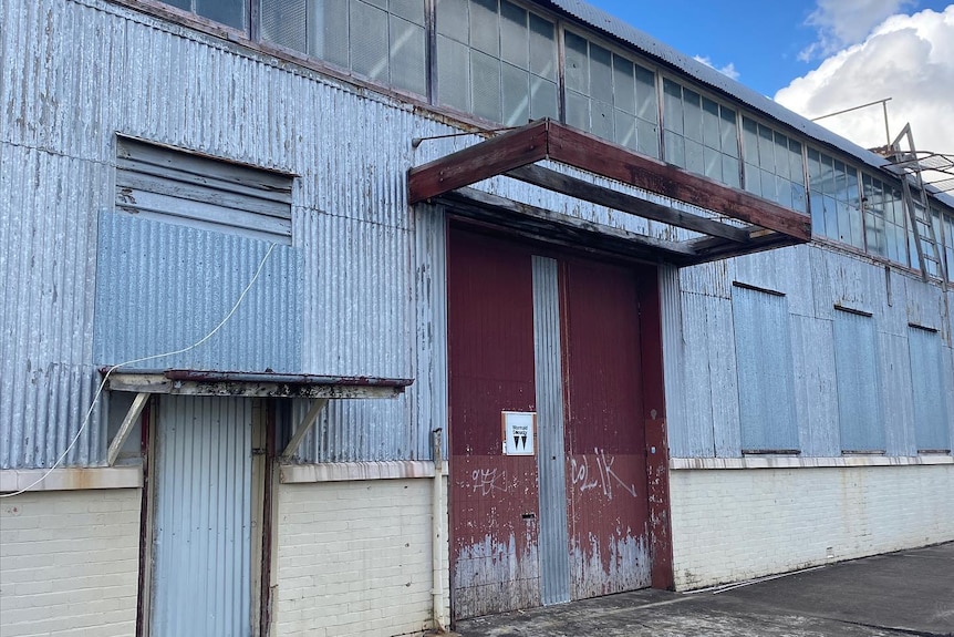 The exterior corrugated iron and brick walls of an industrial building, built in Salisbury during World War II. 