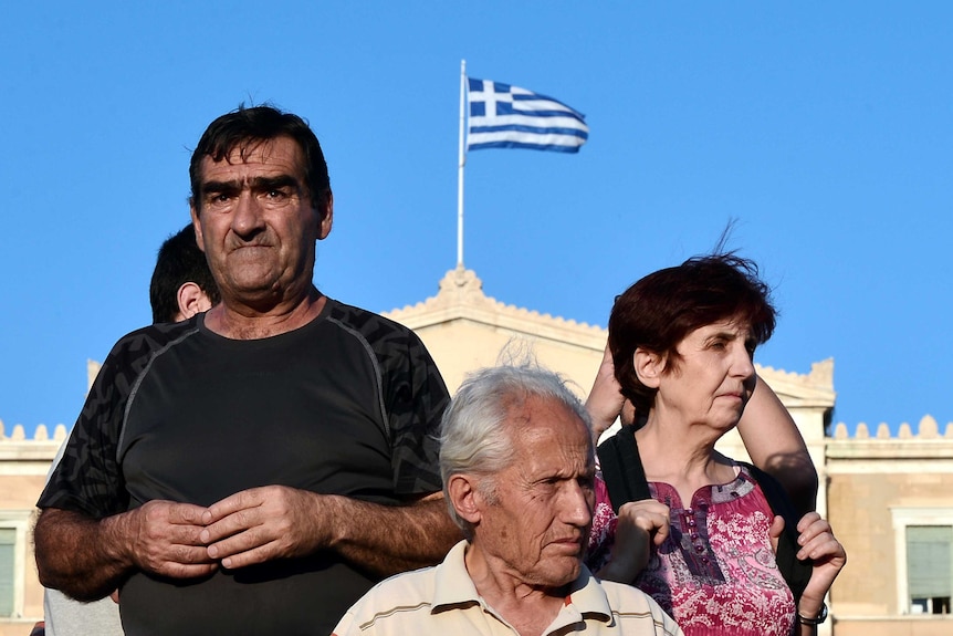 Protesters stand in front of the Greek parliament in central Athens during their rally against EU-IMF loan deal
