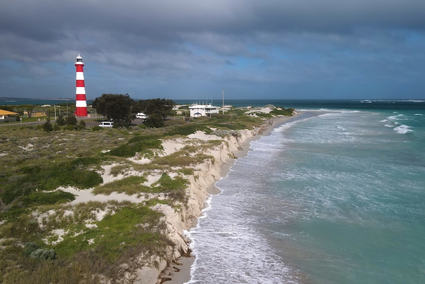 A big bank of clouds sits above a river mouth.