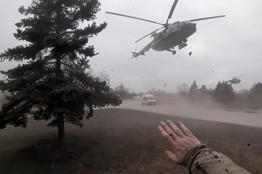 A Ukrainian medical evacuation helicopter lands in front of Yuliia Paievska, known as Taira, in Mariupol.