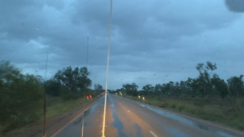 Rain hitting a road.