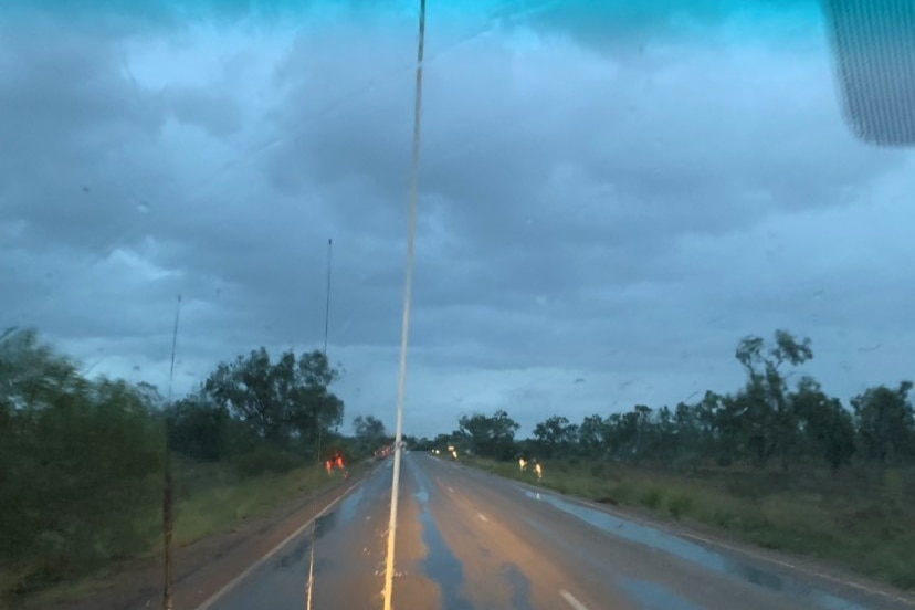Rain hitting a road.