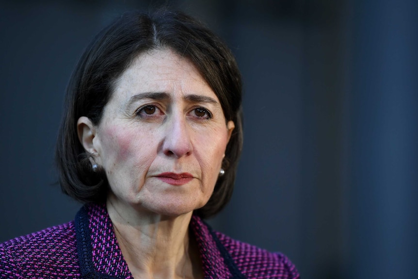 NSW Premier Gladys Berejiklian, brown hair green blaiser