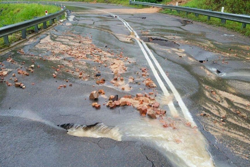 A damaged and broken road.