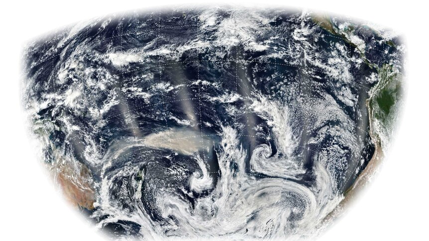 A satellite image of the southern hemisphere with smoke over the Pacific Ocean