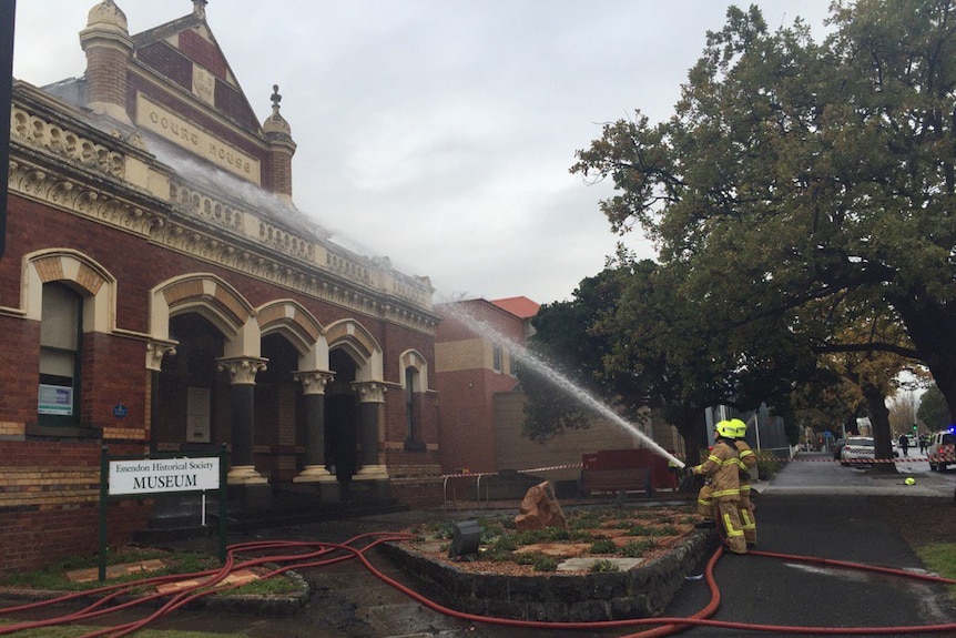 Fire fighters extinguish a blaze at an old courthouse at Moonee Ponds