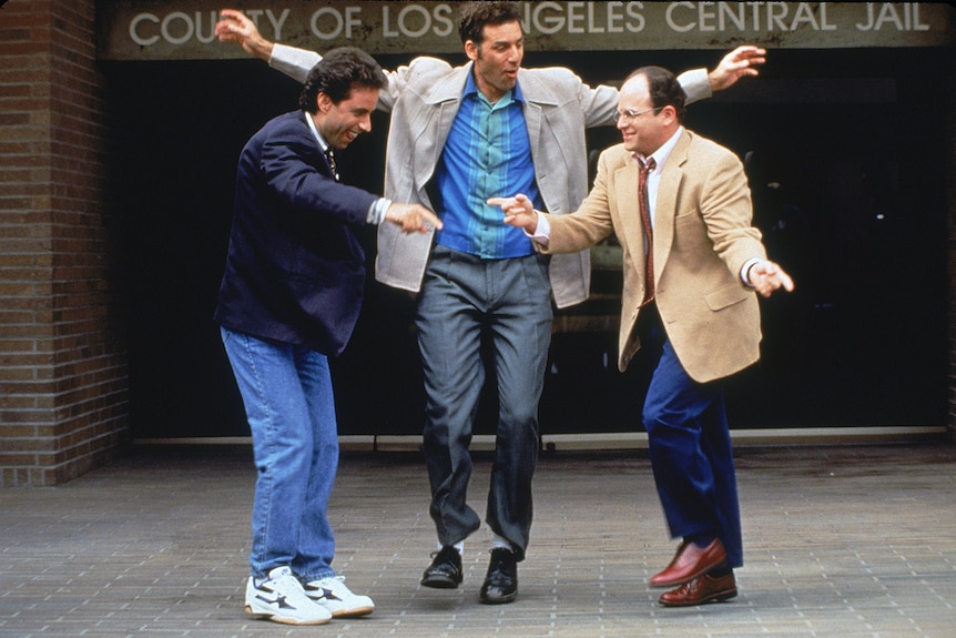 A still of Jerry, Kramer and George dancing outside the County of Los Angeles central jail