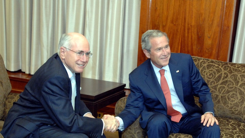 John Howard and George W Bush have agreed to upgrade Australian access to US military technology to the same level that Britain has.