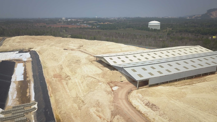 A drone shot of a huge pile of dirt at a rare earths facility in Malaysia
