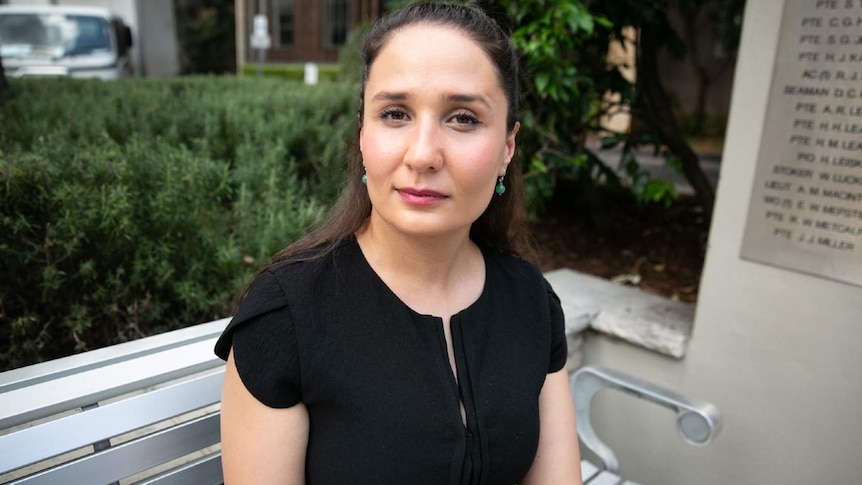 A woman poses for a photo